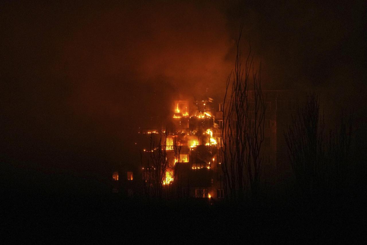 A fire burns at an apartment building after it was hit by the shelling of a residential district in Mariupol, Ukraine, Friday, March 11, 2022. (AP Photo/Evgeniy Maloletka)