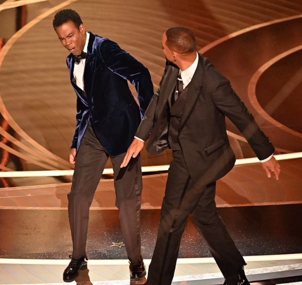 Will Smith tearfully apologises after slapping Chris Rock for making joke about his wife as the police reacts to the altercation (video)