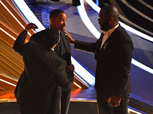 Denzel Washington, Tyler Perry, and Bradley Cooper comfort Will Smith after he slapped Chris Rock at the Oscars 