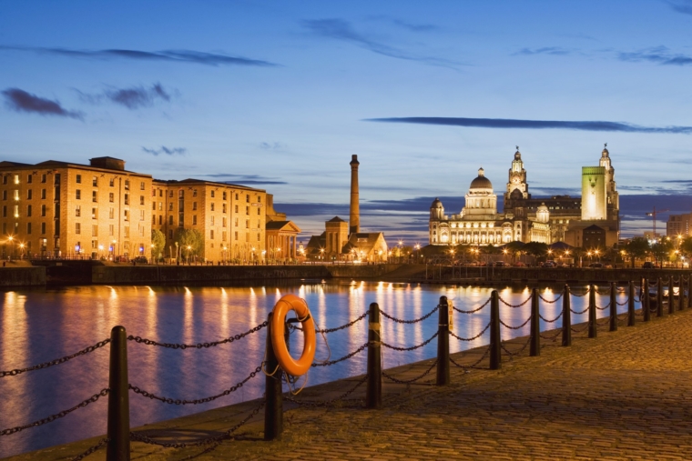 View of Albert Dock and the Three Graces (Royal Liver Building, Cunard Building, Port of Liverpool Building) in Liverpool.