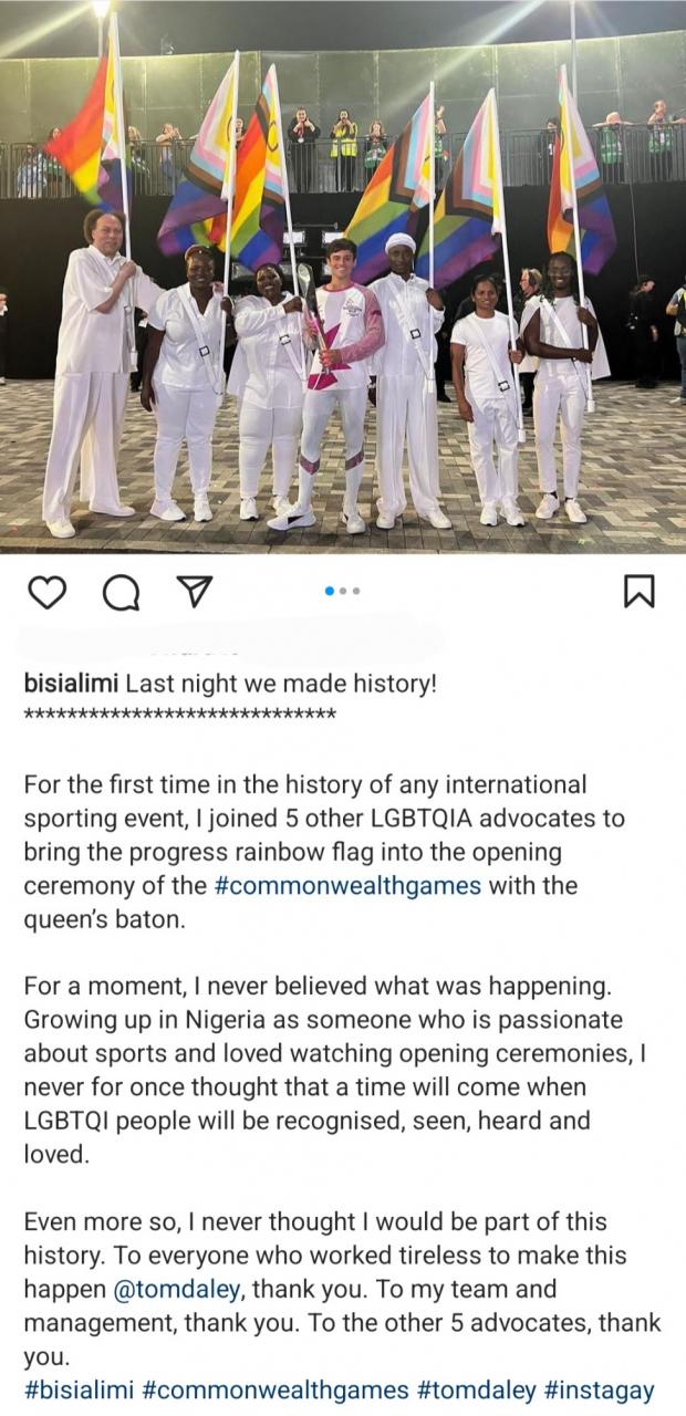 Bisi Alimi celebrates breaking record with other LGBTQ members as they fly rainbow flag at the Commonwealth games opening ceremony