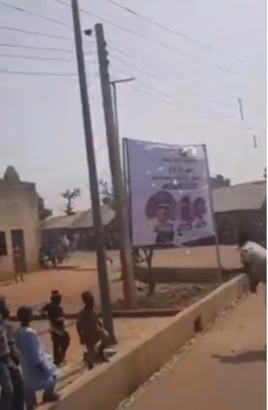 Kids chant 'bamayi' we don't want as they destroy and burn billboard with President Muhammadu Buhari and Governor Nasir El-Rufais photo in it