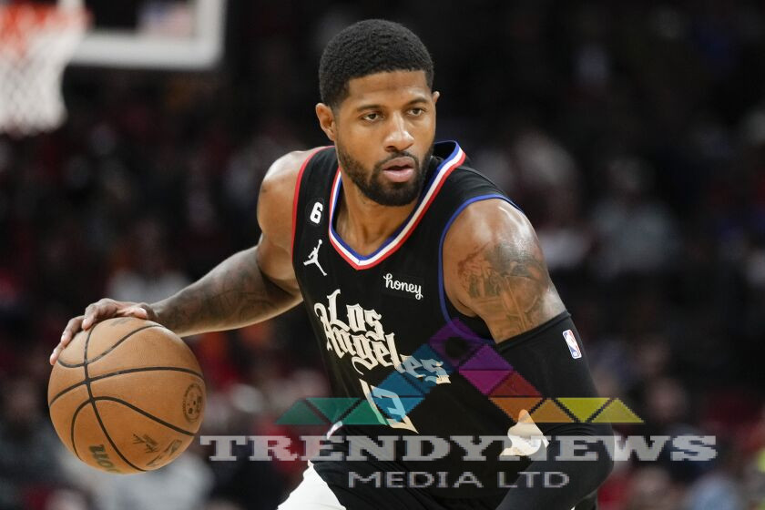 Los Angeles Clippers guard Paul George dribbles during the second half of an NBA basketball game.