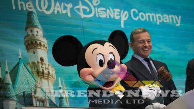 Mickey Mouse and chief executive officer and chairman of The Walt Disney Company Bob Iger